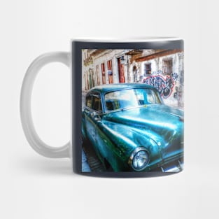 Old green American car on the streets of Havana Cuba Mug